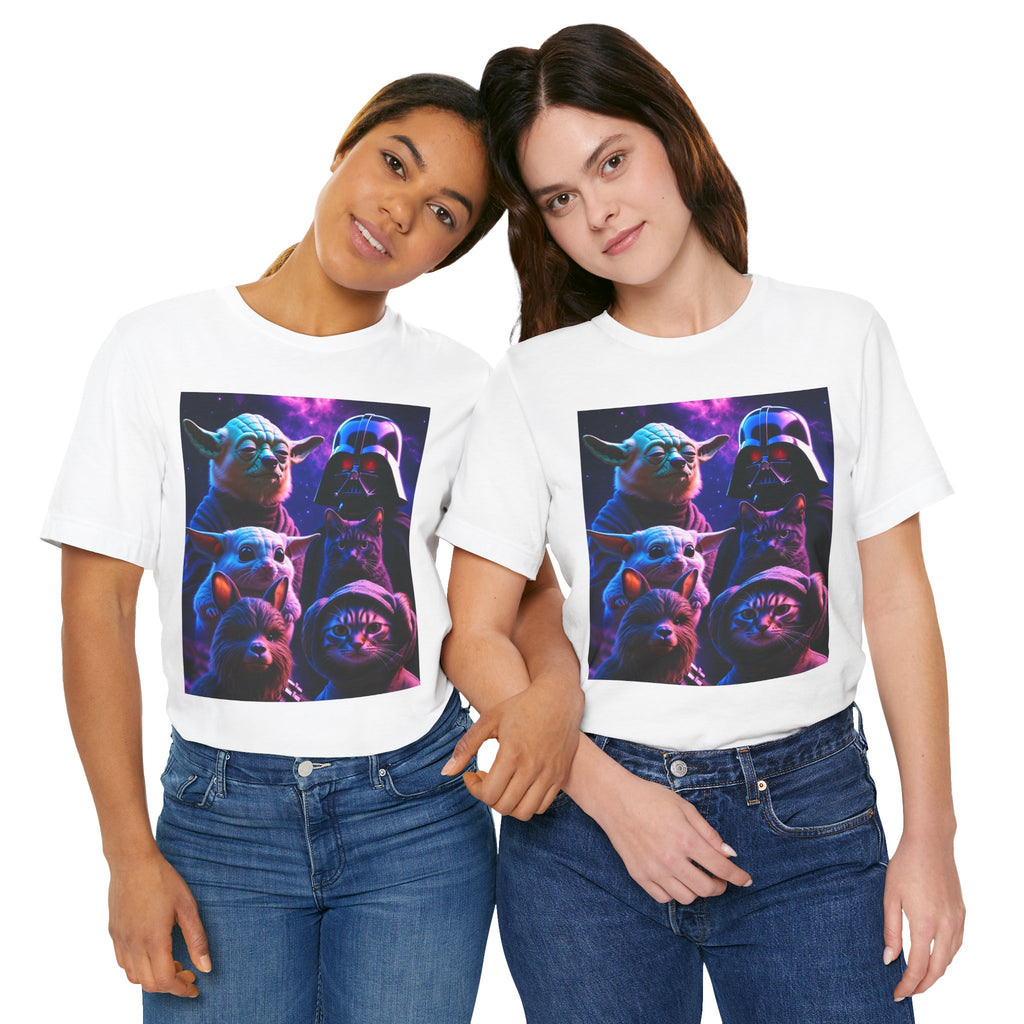 Two women wearing white t-shirts featuring a colorful graphic of a cat and dog dressed as Yoda and Darth Vader.
