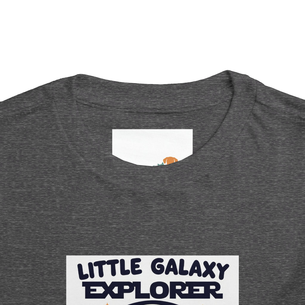 Gray kids' t-shirt featuring "Little Galaxy Explorer" text and a colorful space-themed graphic on the front.