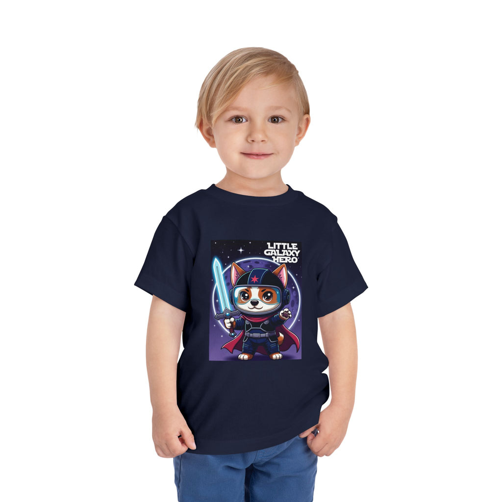 Little Galaxy Hero kids t-shirt featuring a cartoon space puppy with a lightsaber on a navy background.