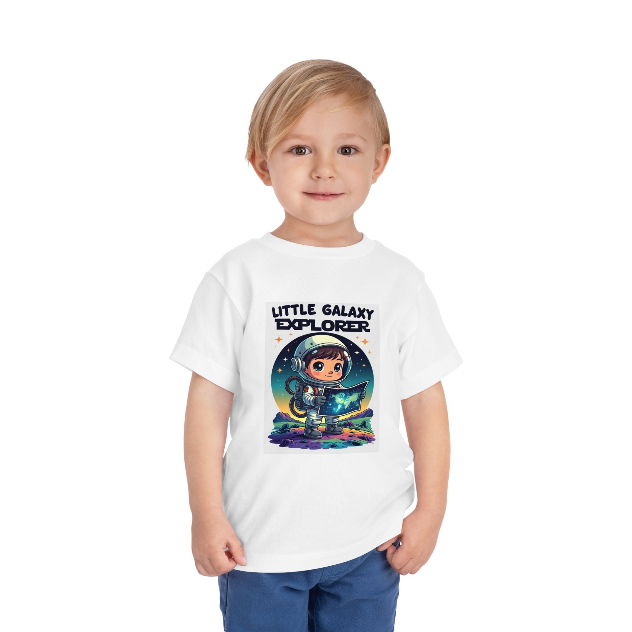 White kids' t-shirt featuring a cartoon astronaut holding a map with "Little Galaxy Explorer" text above.