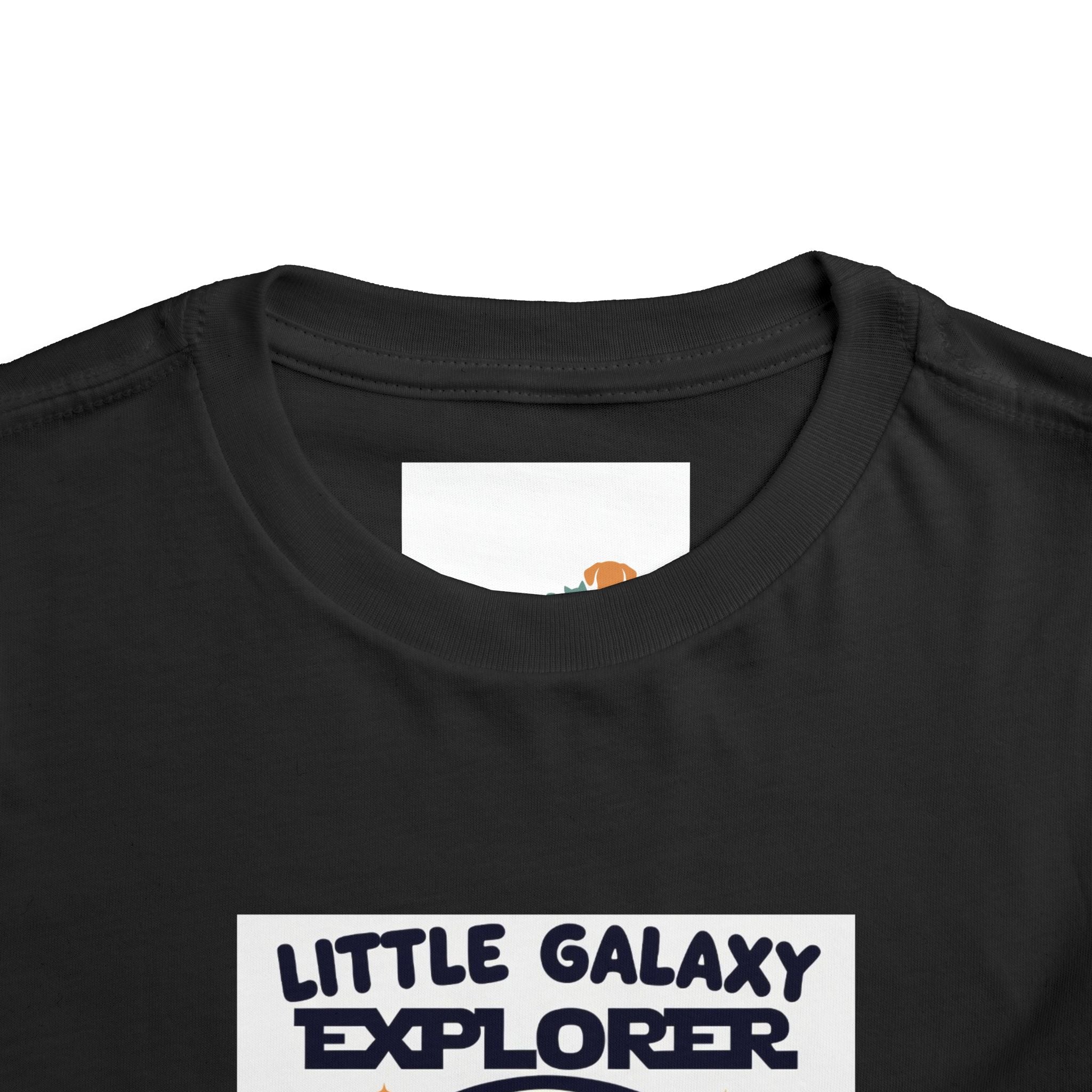 Black kids' t-shirt featuring "Little Galaxy Explorer" text and a colorful space-themed graphic on the front.