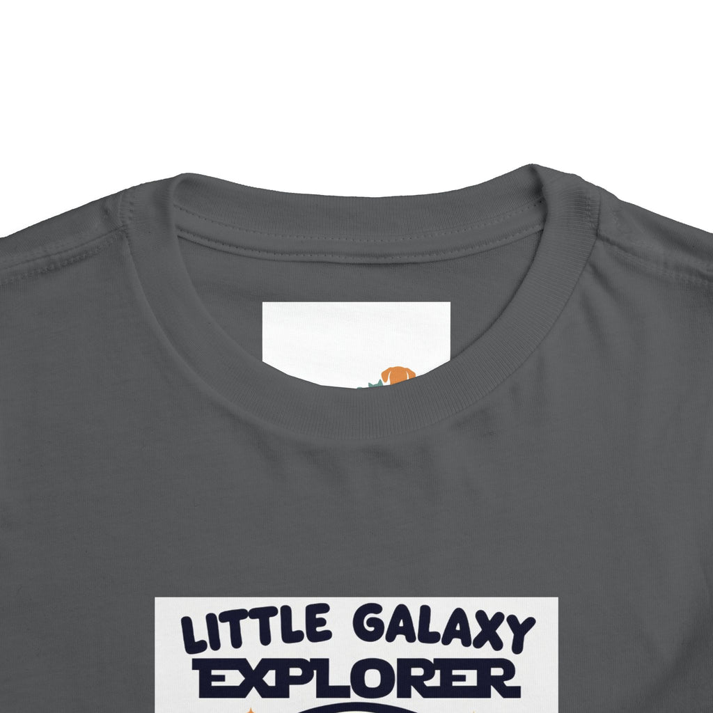 Gray kids' t-shirt featuring "Little Galaxy Explorer" text and a colorful space-themed graphic on the front.