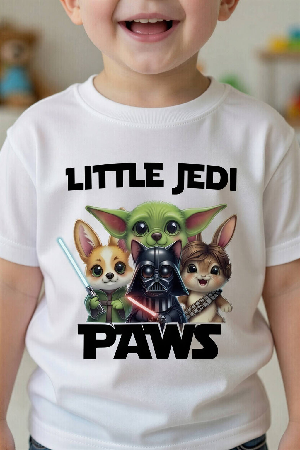 Toddler tee featuring cartoon mashup of Yoda, Darth Vader, and Chewbacca with "Little Jedi Paws" text.