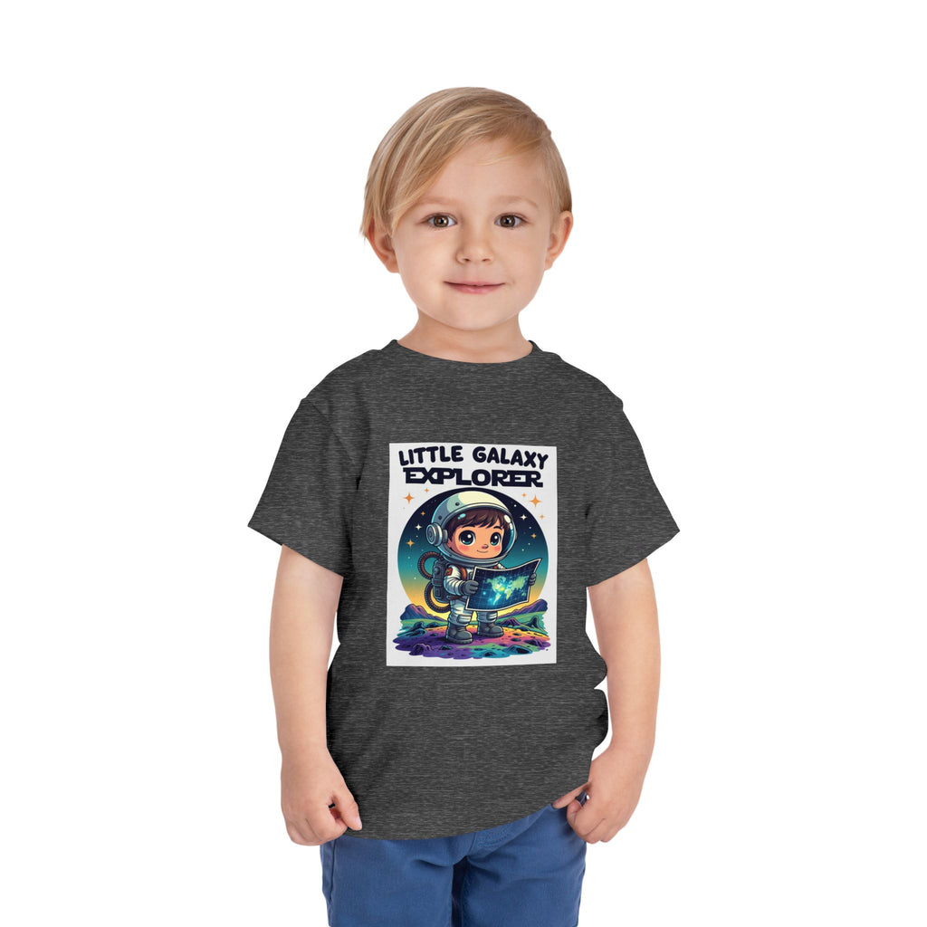 Little Galaxy Explorer kids t-shirt in dark gray featuring a cartoon astronaut holding a map with stars in the background.