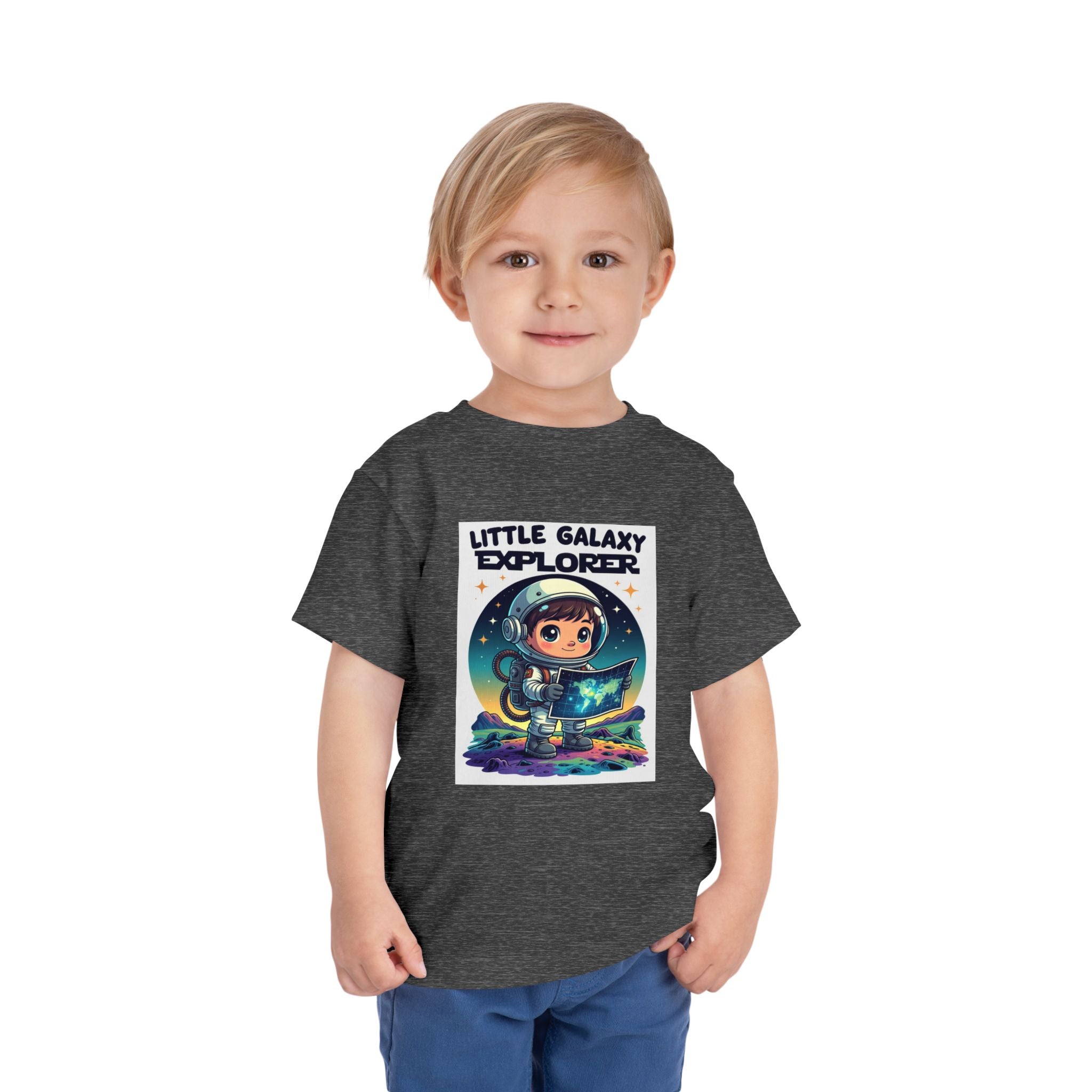 Little Galaxy Explorer kids t-shirt in dark gray featuring a cartoon astronaut holding a map with stars in the background.
