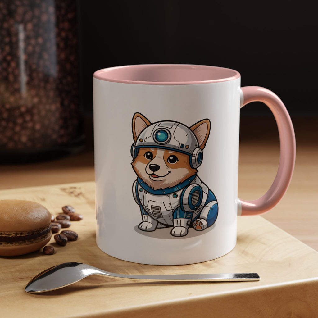Corgi R2-D2 coffee mug with a pink handle, featuring a cartoon corgi in a droid outfit, placed on a wooden surface.