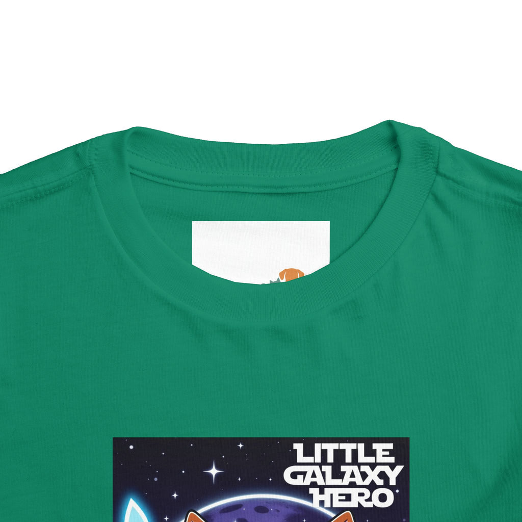Green kids' t-shirt featuring a cartoon space puppy with the text "Little Galaxy Hero" and a starry background.