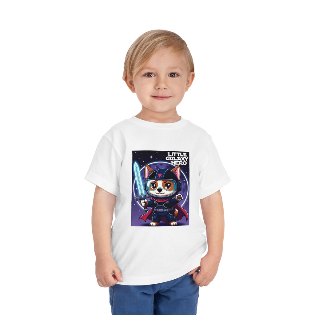 Little Galaxy Hero kids t-shirt featuring a cartoon space puppy in a superhero costume with a lightsaber.