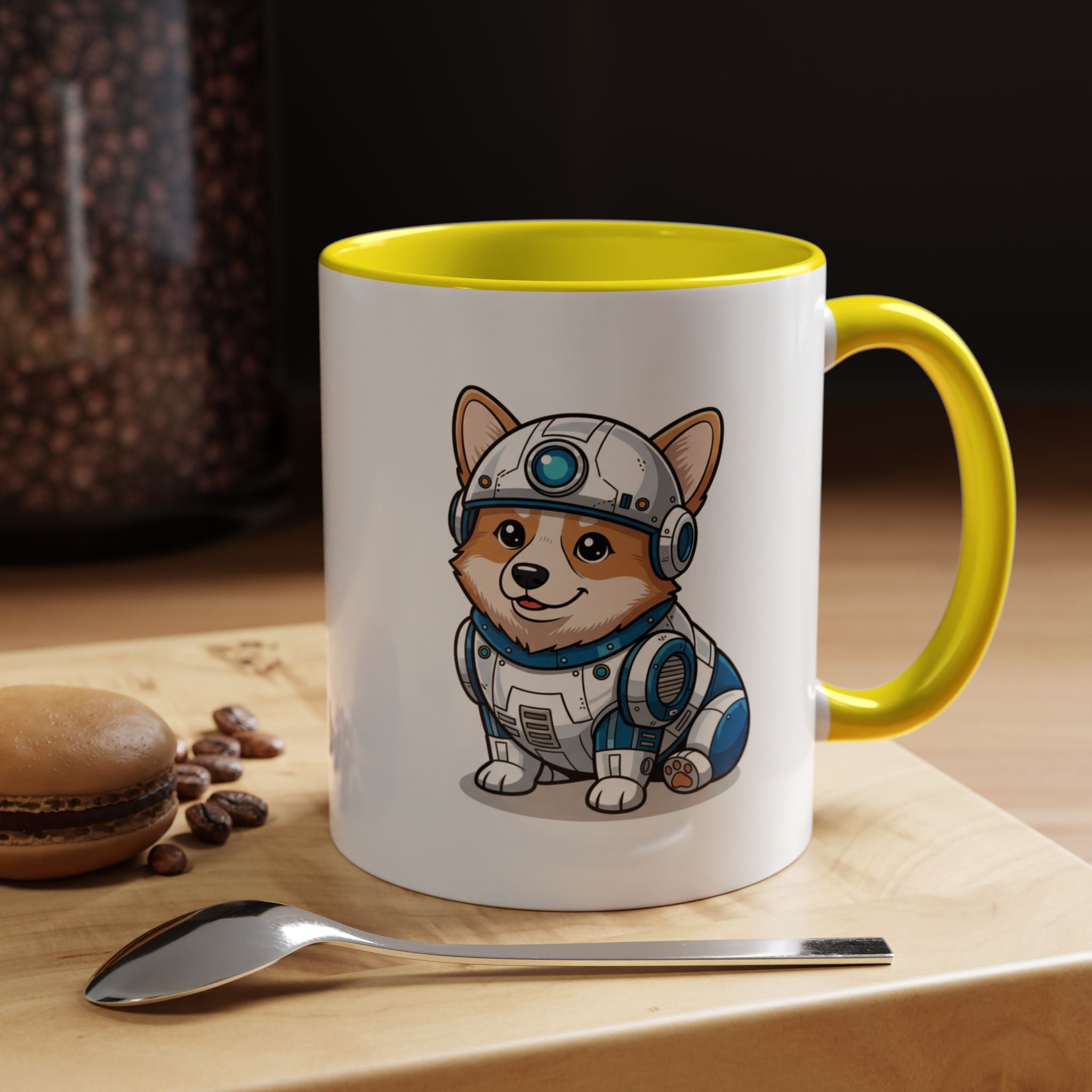 Corgi R2-D2 coffee mug with yellow handle, featuring a cartoon corgi in a droid costume, placed on a wooden surface.