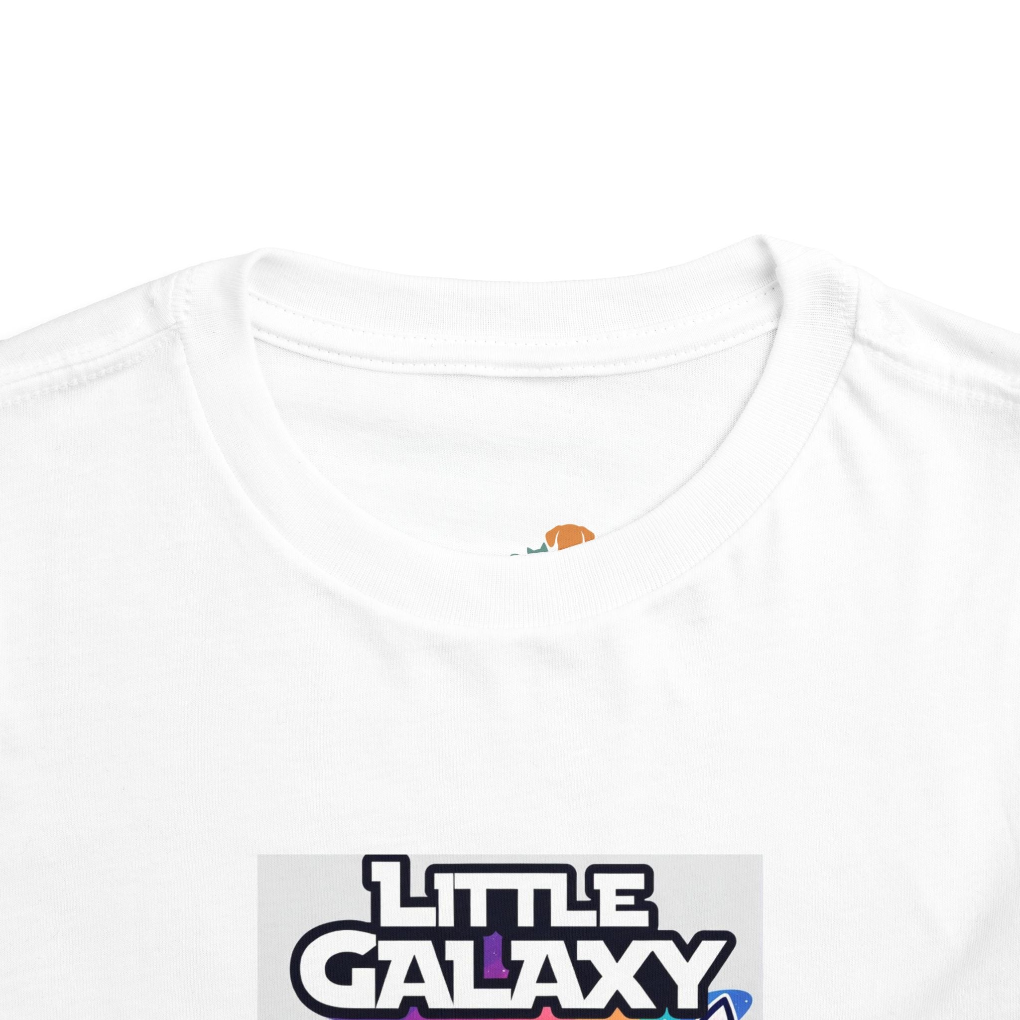 White kids t-shirt featuring a cartoon space warrior design with the text "Little Galaxy" in bold colors.