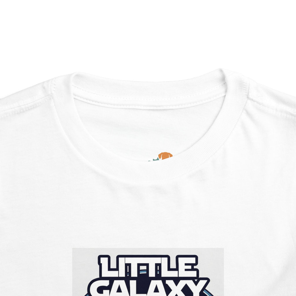 Little Galaxy Pilot kids t-shirt featuring a white fabric with a colorful astronaut graphic on the front.