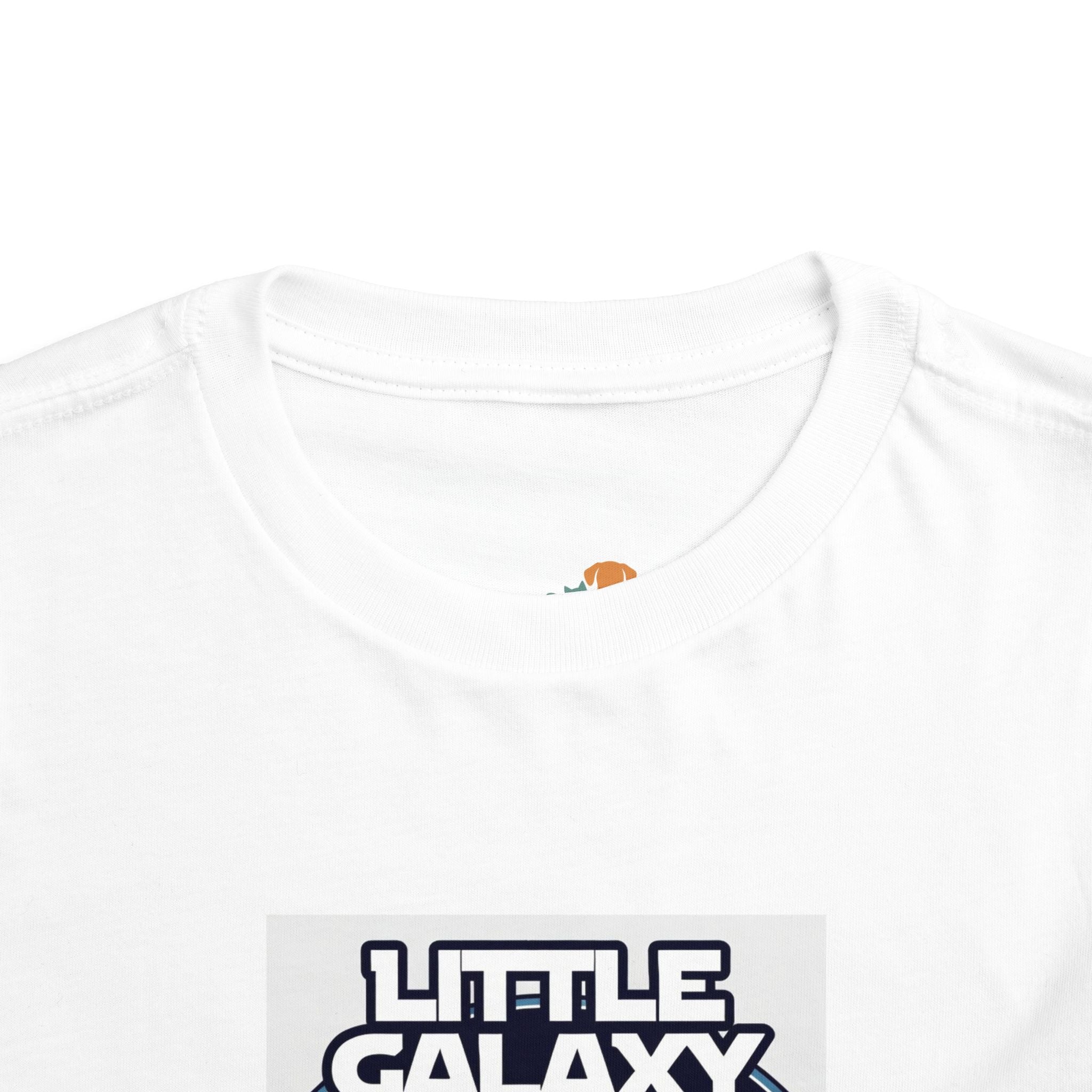 Little Galaxy Pilot kids t-shirt featuring a white fabric with a colorful astronaut graphic on the front.