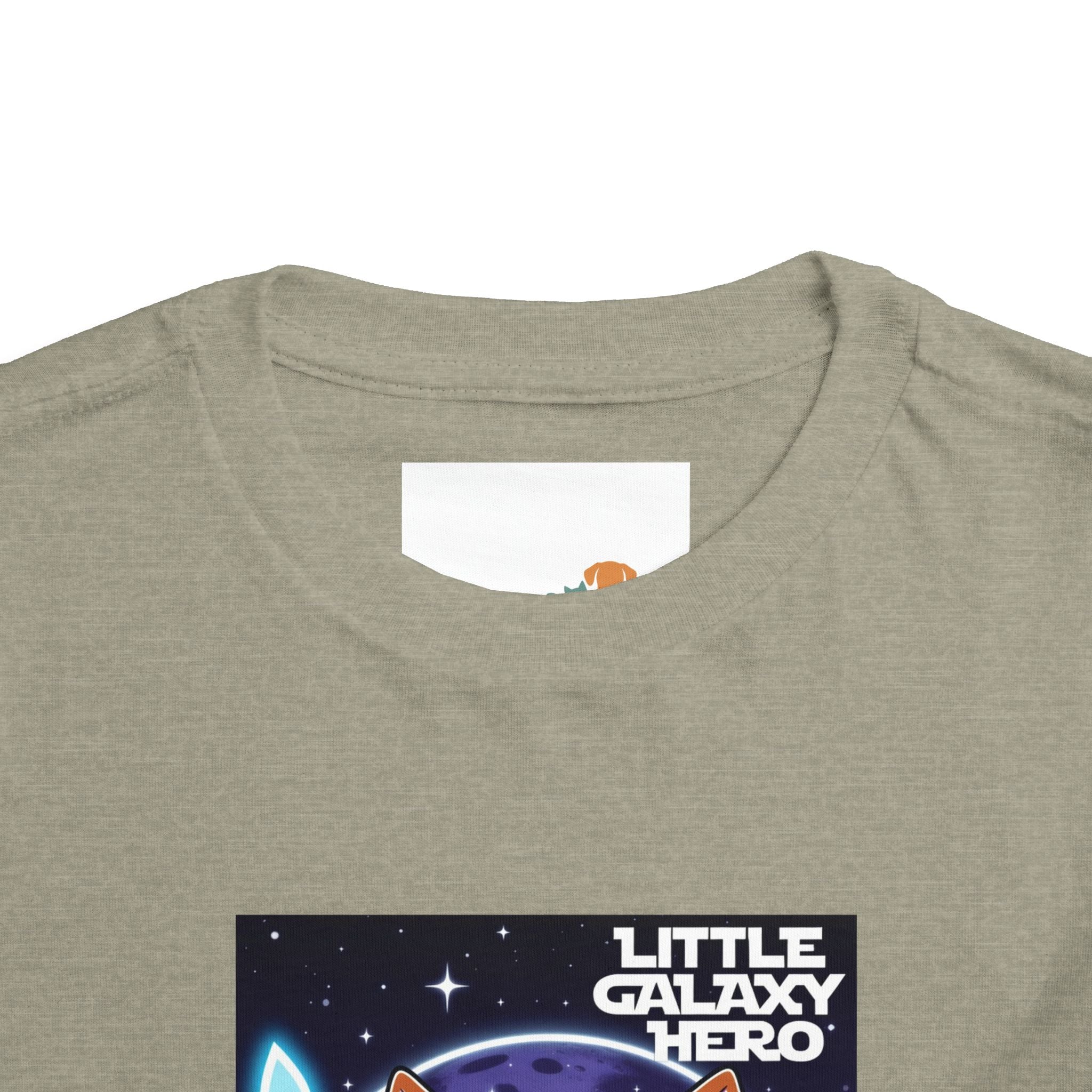 Light gray kids t-shirt featuring a cartoon space puppy and the text "Little Galaxy Hero" in colorful lettering.