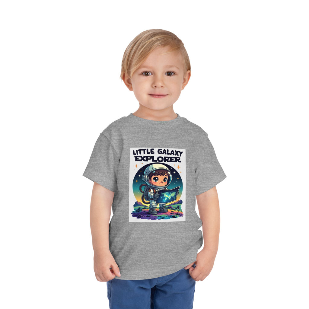 Gray kids' t-shirt featuring a cartoon astronaut holding a star map, with "Little Galaxy Explorer" text above.