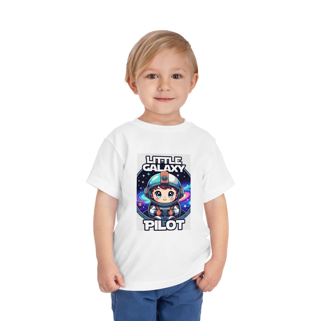 Little Galaxy Pilot kids t-shirt featuring a cute astronaut graphic on a white background, worn by a young child.