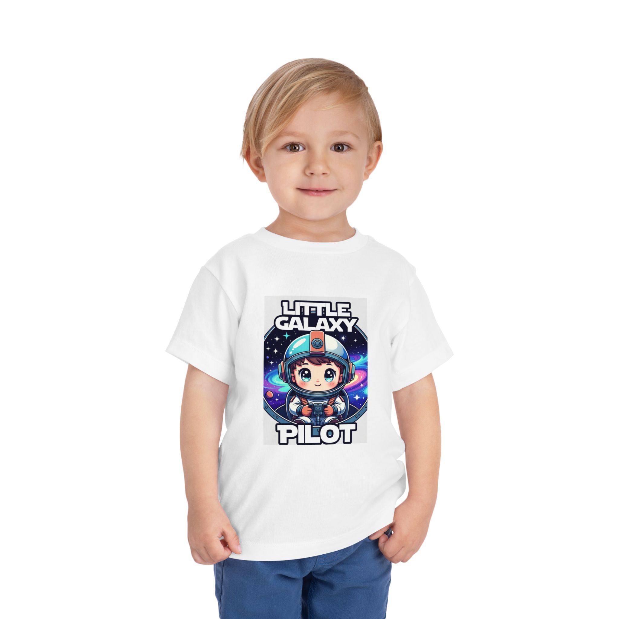 Little Galaxy Pilot kids t-shirt featuring a cute astronaut graphic on a white background, worn by a young child.