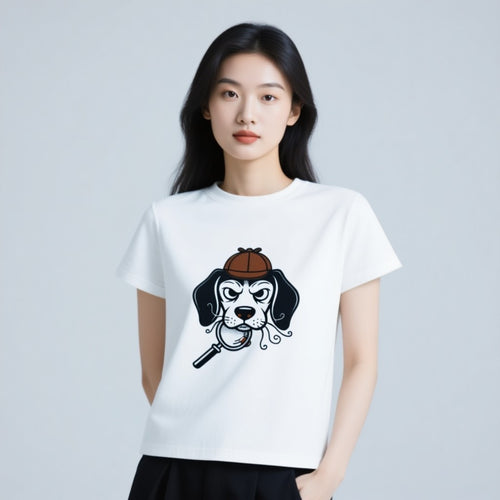 Beagle Detective T-Shirt featuring a cartoon dog with a magnifying glass and detective hat on a white background.